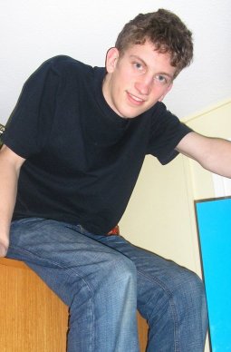 Here is Sam just after rescuing a little kitten from on top of a dangerous wardrobe